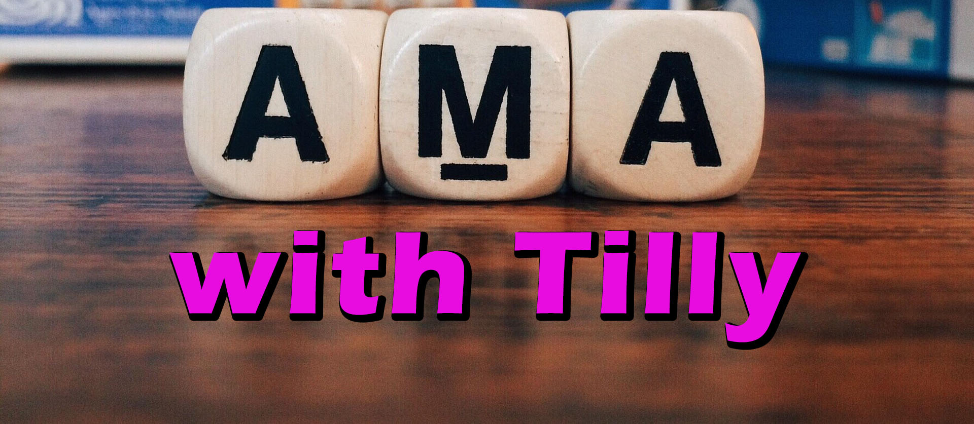 three boggle cubes showing "AMA" with pink text under them that reads "with Tilly"