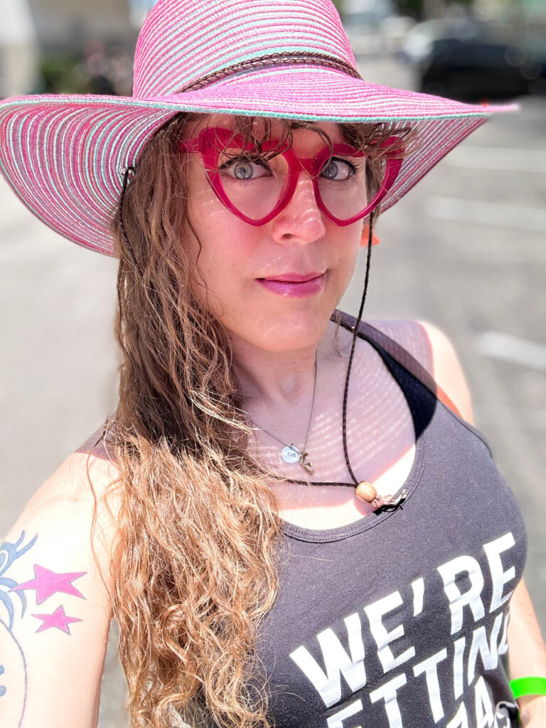 Me outside in very direct, harsh sunlight, but my sun hat turns that into soft, diffuse light on my face.